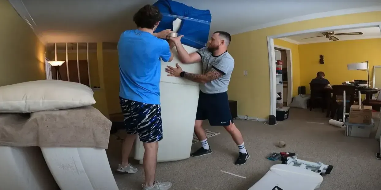 Professional movers carrying boxes